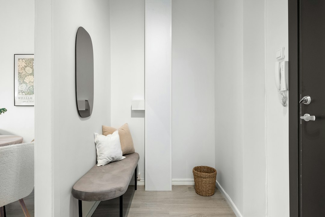 A clean and welcoming entryway of a modern short-term rental, symbolizing the positive guest experience that comes from excellent communication.